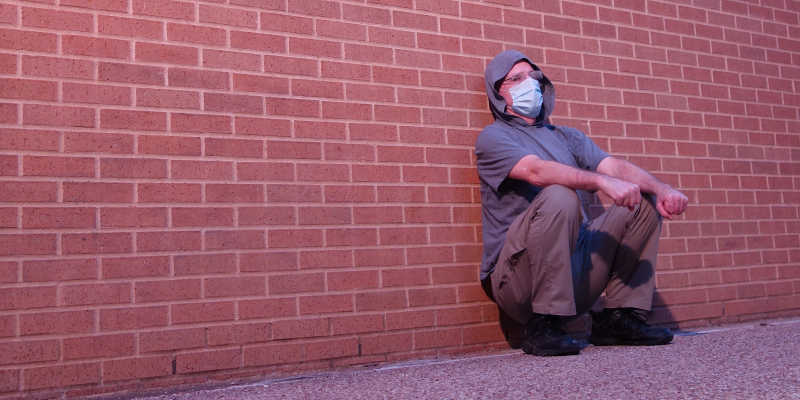 Squatting Against a Wall During the Covid-19 Pandemic